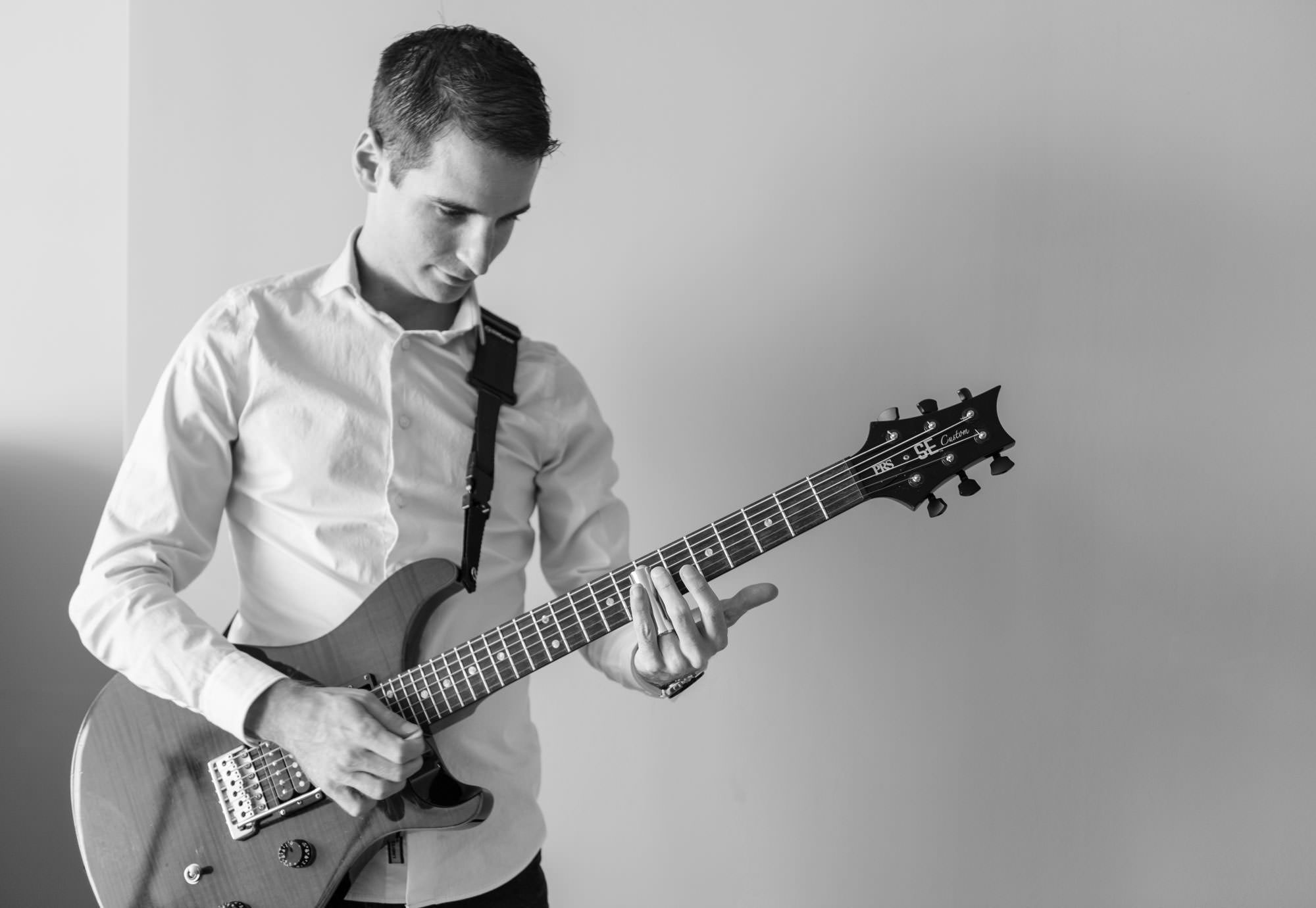 Nick Grinlinton plays guitar